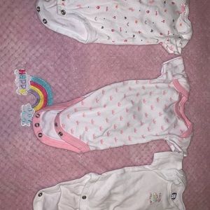 Baby sleepers and onsies. Sizes range from newborn